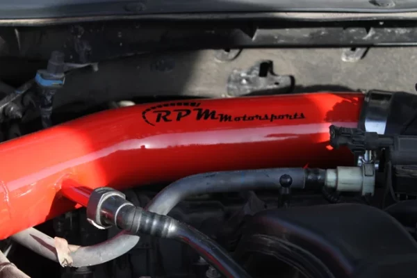 Close up photo of the 2015 Chrysler 200 Cold Air Intake painted in Race Red for the 3.6L Pentastar V6.