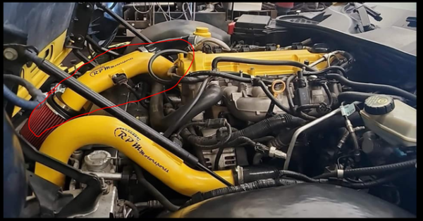 Installed photo of the Cold Air Intake Kit for Pontiac Solstice GXP and Saturn Sky Redline shown in Yellow paint.