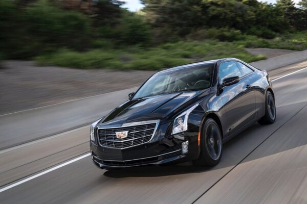 Cadillac ATS with 2.0L LTG Ecotec Engine in Black Paint rolling down the road.