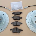 Rear Brake Upgrade Kit for Pontiac Solstice and Saturn Sky featuring Drilled and Slotted Rotors, Ceramic Composite Pads, and Braided Steel Lines