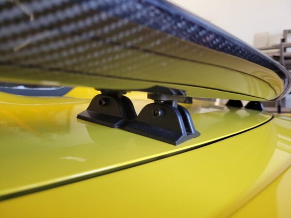 Close up photo of the mounting brackets for the Pontiac Solstice and Saturn Sky Carbon Fiber Spoiler.